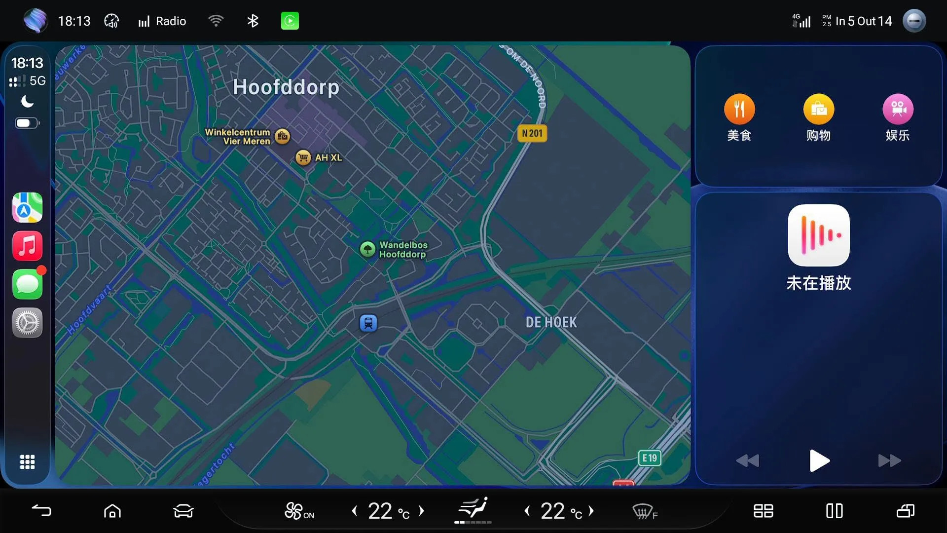 Head-unit screenshot with Apple CarPlay in a split layout: an Apple Maps view of Hoofddorp on the left with the CarPlay sidebar (Maps, Music, Messages, Settings), and BYD widgets on the right for food, shopping and entertainment plus a media player showing nothing playing.
